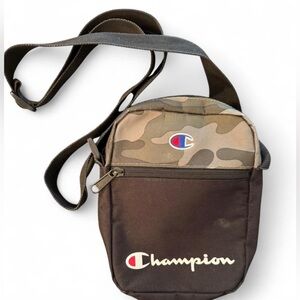CHAMPION Manuscript crossbody bag. Camo and black, lined with bright blue logo